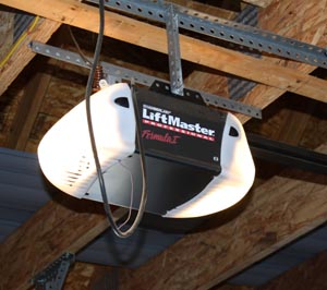 Minimalist Garage door opener light bulb stays on  overhead garage door