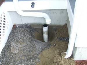 Connecting A Gutter Downspout to Foundation Drain - Home Construction